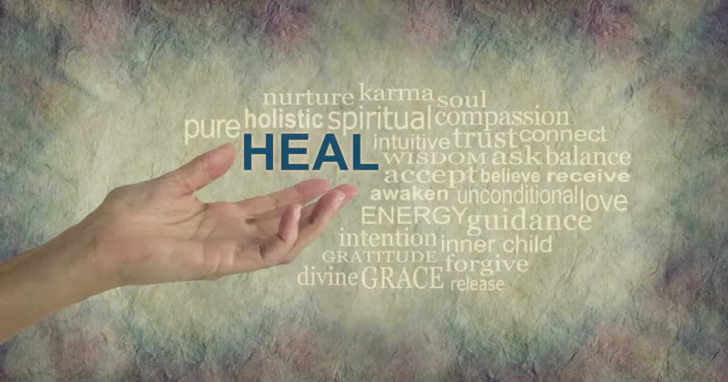 A open hand with the word 'heal' floating above it, along with a word cloud of other words similar to heal.